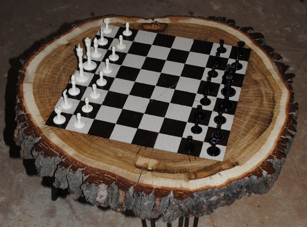 Custom chess game on wood piece.